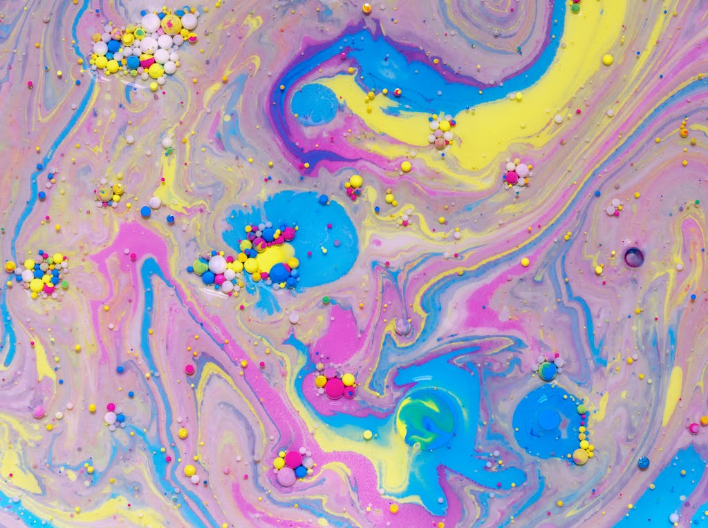 An abstract and colorful swirl pattern featuring vibrant hues and textures, ideal for art and design projects.